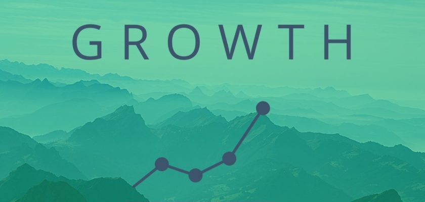 Mountains in shades of teal fill the image behind the word "GROWTH," which is seated above a linear growth expression, illustrating the way our Little Rock digital marketing agency can affect your business.